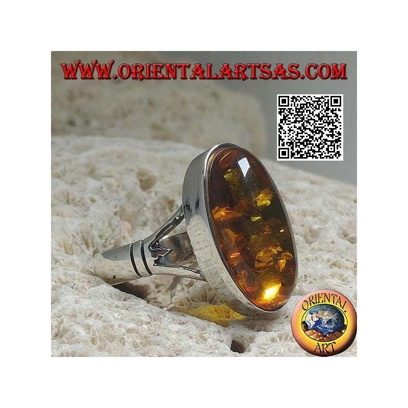 Silver ring with an elongated oval cabochon amber attached to two