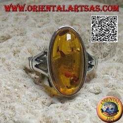 Silver ring with an elongated oval cabochon amber attached to two