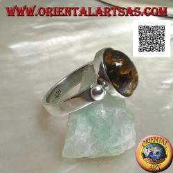 Silver ring with oval green cabochon amber with side ball on smooth setting
