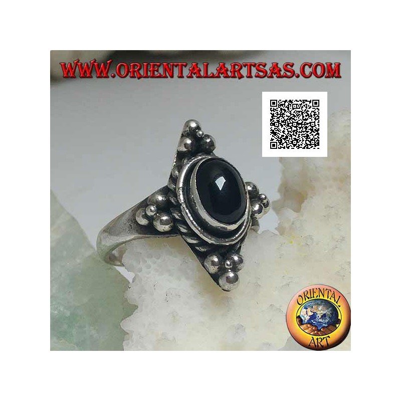 Silver ring with oval onyx surrounded by intertwining and trio of balls on the four cardinal points