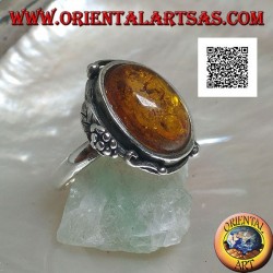 Silver ring with cabochon oval amber with two balls and a leaf on the edge (thin)