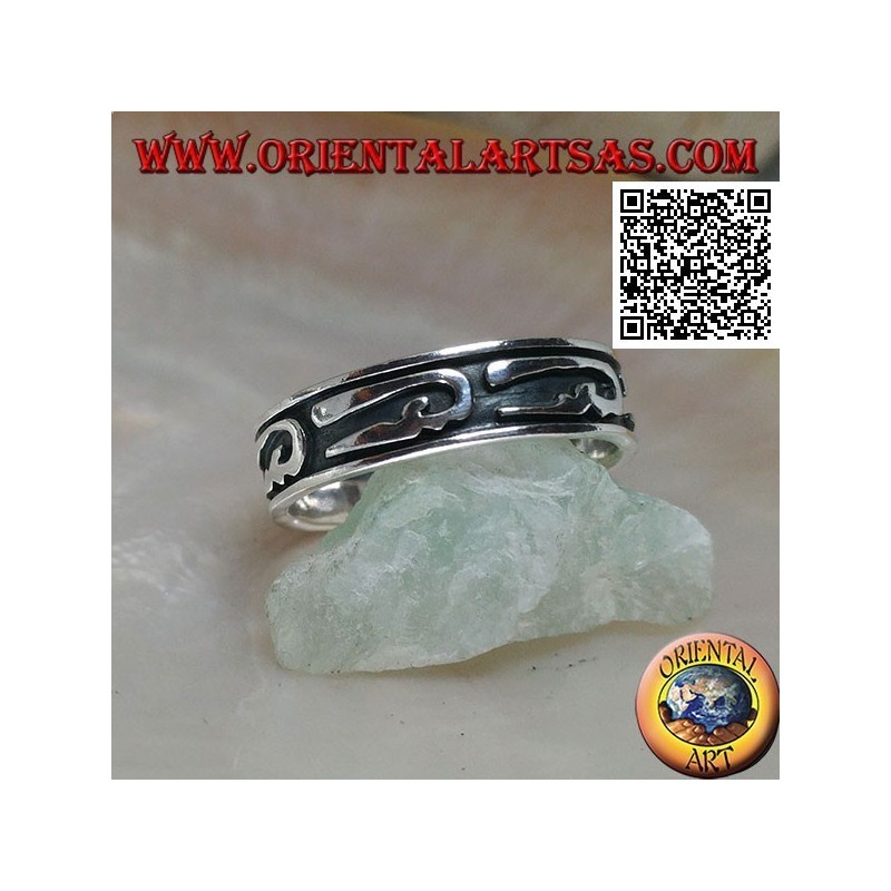 Silver ring with stylized U-shaped designs in bas-relief