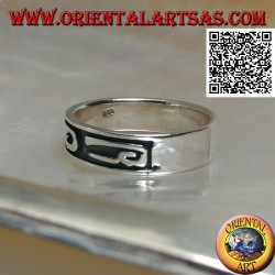Silver ring with stylized U-shaped designs in bas-relief