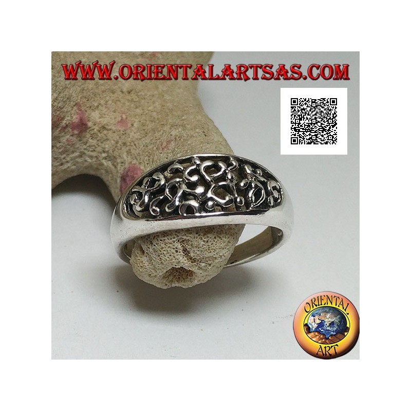 Silver ring with dense openwork decoration on a horizontal oval