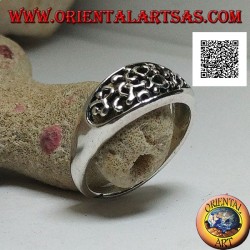 Silver ring with dense openwork decoration on a horizontal oval