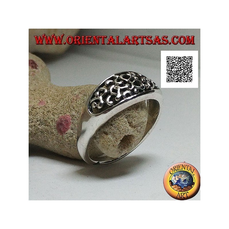 Silver ring with dense openwork decoration on a horizontal oval
