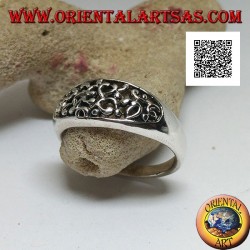 Silver ring with dense openwork decoration on a horizontal oval