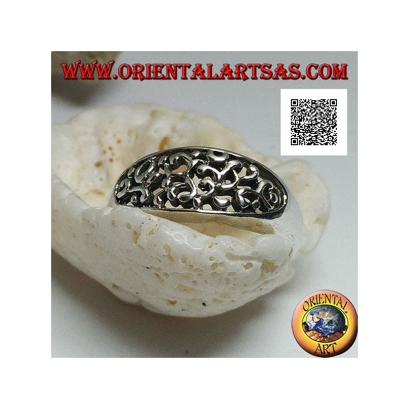 Silver ring with dense openwork decoration on a horizontal oval