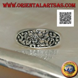 Silver ring with dense openwork decoration on a horizontal oval