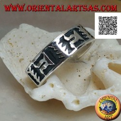 Silver ring with oriental artistic motif in bas relief