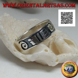 Silver ring with spirals and Maori drawings in bas-relief