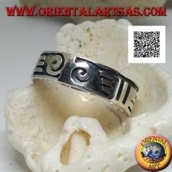 Silver ring with spirals and Maori drawings in bas-relief