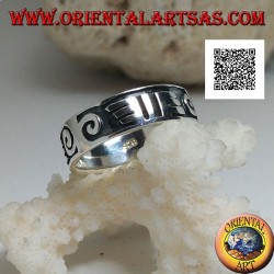 Silver ring with spirals and Maori drawings in bas-relief