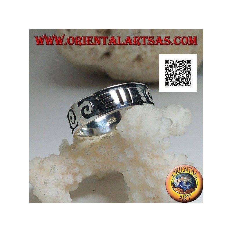 Silver ring with spirals and Maori drawings in bas-relief