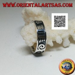 Silver ring with spirals and Maori drawings in bas-relief