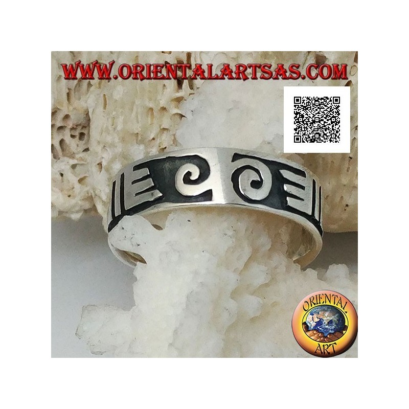 Silver ring with spirals and Maori drawings in bas-relief