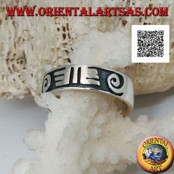 Silver ring with spirals and Maori drawings in bas-relief