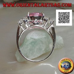 Rhodium silver ring with pink round faceted zircon with side white zircons