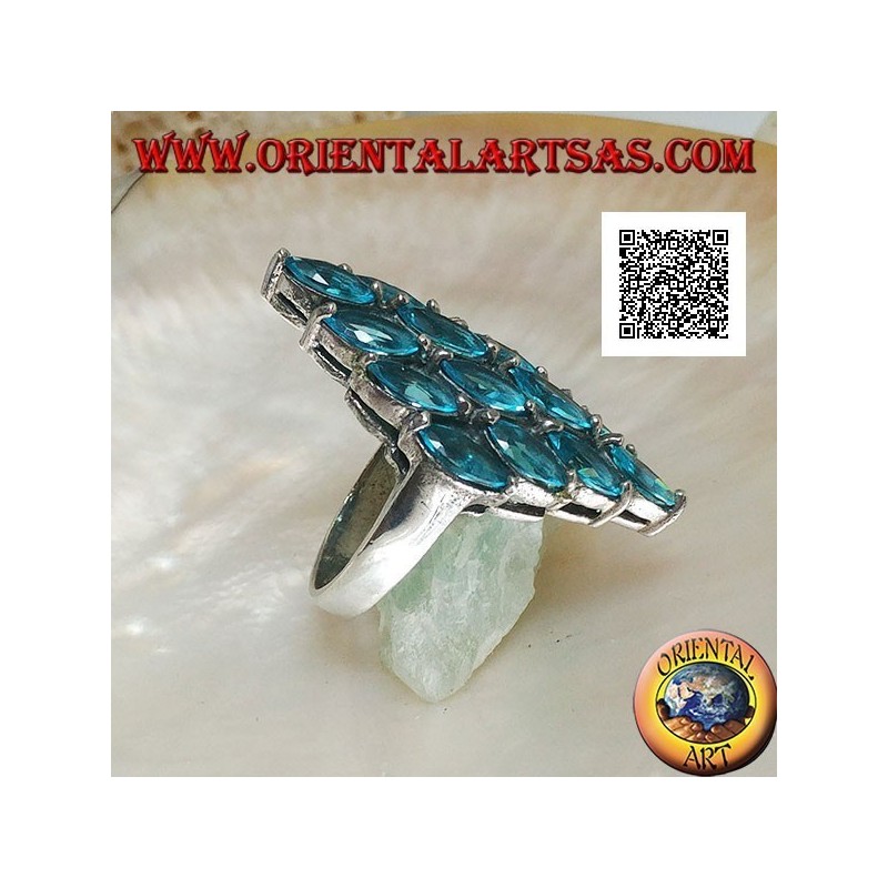 Silver ring in the shape of a rhombus formed by 16 oval blue topazes set