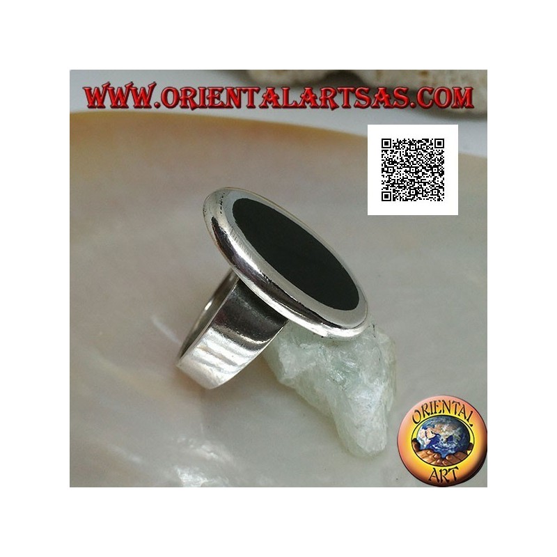 Silver ring with oval onyx set flush with the edge with smooth contour