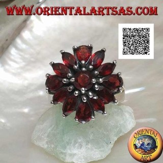 Silver ring with raised flower of 13 natural round, shuttle and drop shaped garnets, set