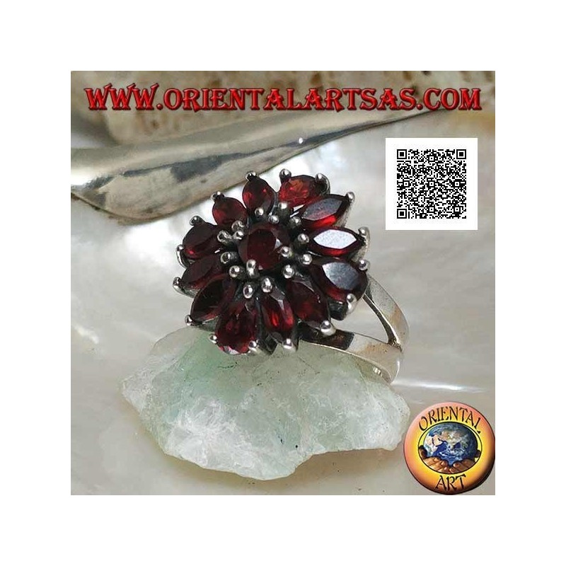 Silver ring with raised flower of 13 natural round, shuttle and drop shaped garnets, set