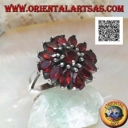 Silver ring with raised flower of 13 natural round, shuttle and drop shaped garnets, set