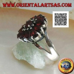 Silver ring with raised flower of 13 natural round, shuttle and drop shaped garnets, set