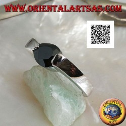 Rhodium silver ring with faceted drop-shaped spinel zircon hooked on the side