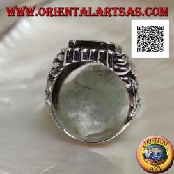 Silver ring with rectangular beveled onyx and curved lines pattern engraved in relief