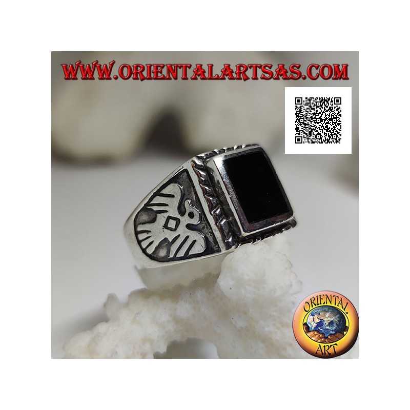 Silver ring with raised rectangular onyx and bas-relief eagle on the sides