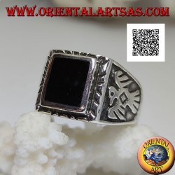 Silver ring with raised rectangular onyx and bas-relief eagle on the sides