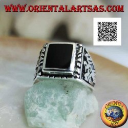 Silver ring with raised rectangular onyx and bas-relief eagle on the sides
