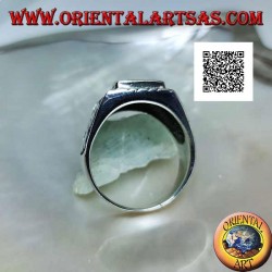 Silver ring with raised rectangular onyx and bas-relief eagle on the sides