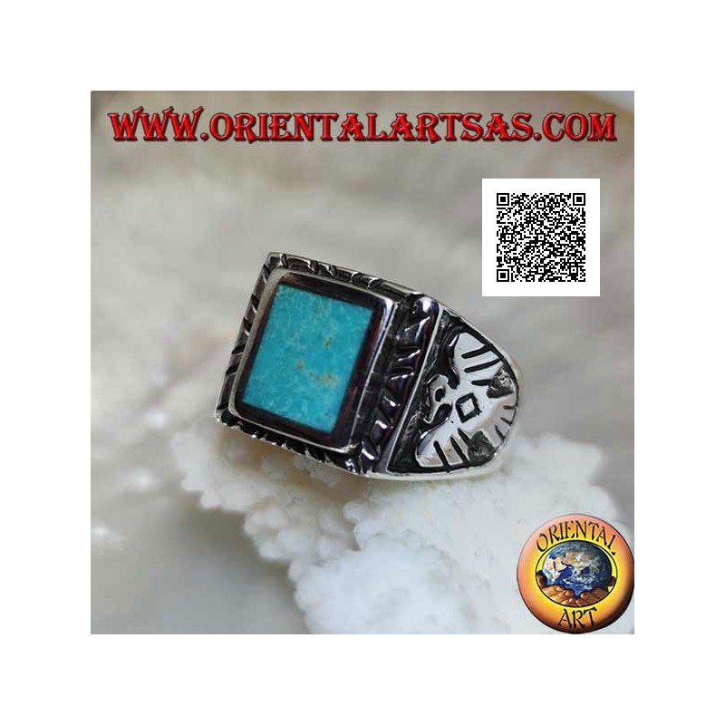 Silver ring with raised rectangular turquoise and bas-relief eagle on the sides