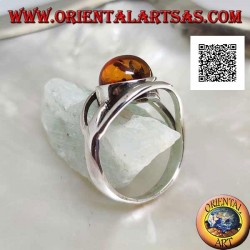 Silver ring with cabochon round amber between two curved lines in silver