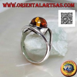 Silver ring with cabochon round amber between two curved lines in silver