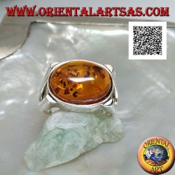 Silver ring with oval cabochon amber crosswise on smooth setting with lateral opening