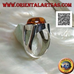 Anillo de plata con cabujón ovalado de ámbar en cruz sobre engaste liso con apertura lateral