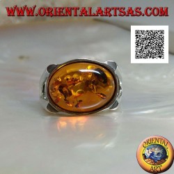 Bague en argent avec cabochon ovale ambre en croix sur serti lisse avec ouverture latérale