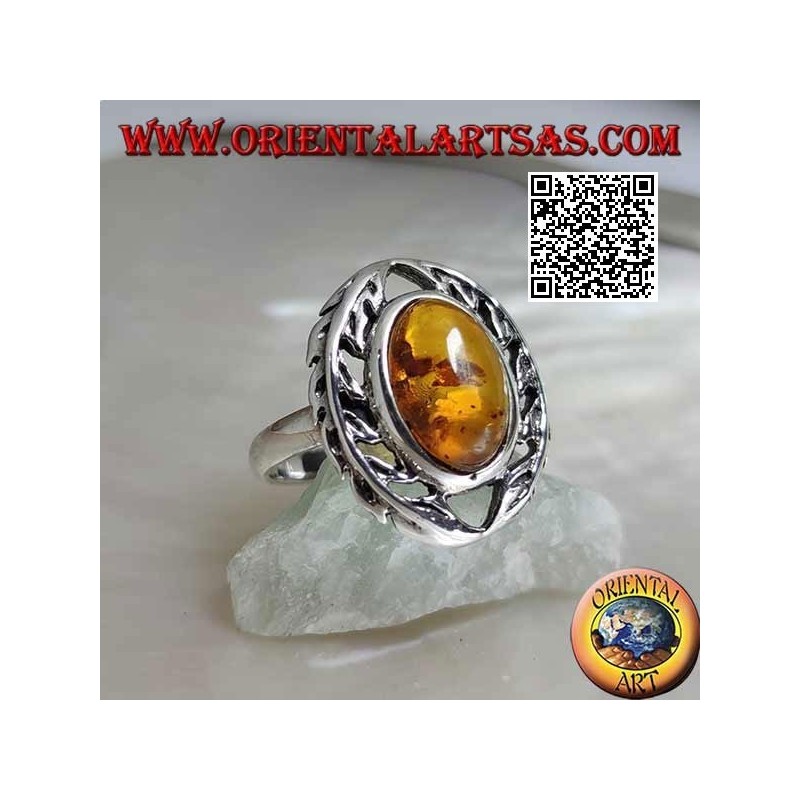 Silver ring with cabochon oval amber between two laurel branches