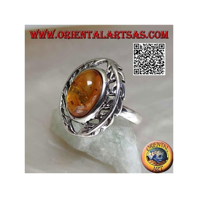 Silver ring with cabochon oval amber between two laurel branches