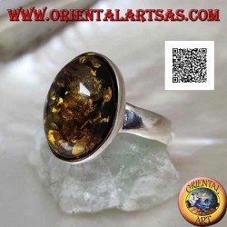 Silver ring with oval cabochon green amber on simple setting and smooth edge