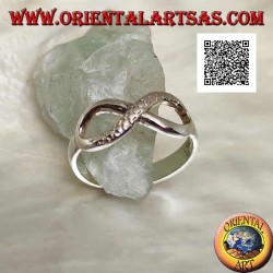 Silver ring with infinity knot symbol with one smooth line and the other snake skin