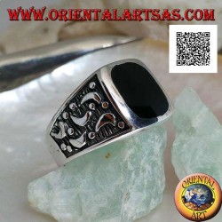 Silver ring with rounded rectangular onyx and moons cut on the sides