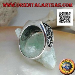 Silver ring with rounded rectangular onyx and moons cut on the sides