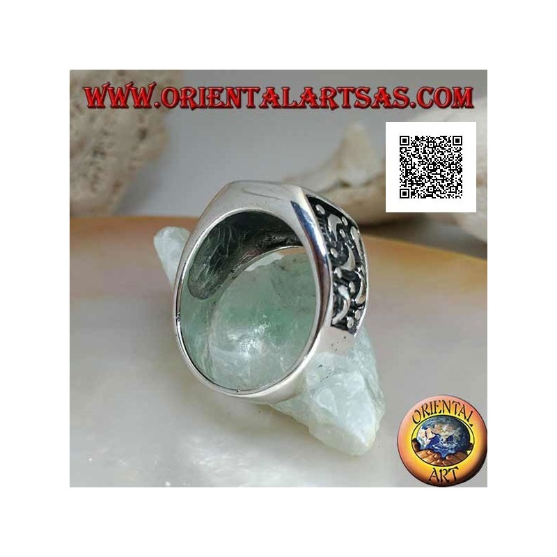 Silver ring with rounded rectangular onyx and moons cut on the sides