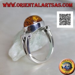 Silver ring with oval cabochon amber crosswise with elongated triangular hole