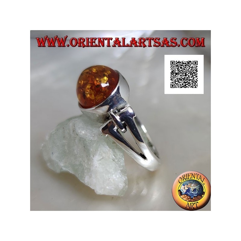Silver ring with oval cabochon amber crosswise with elongated triangular hole