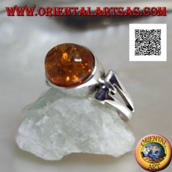 Silver ring with oval cabochon amber crosswise with elongated triangular hole